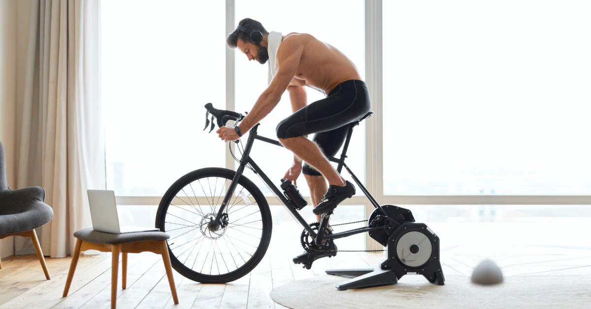 man-exercising-on-spinning-bike-at-home